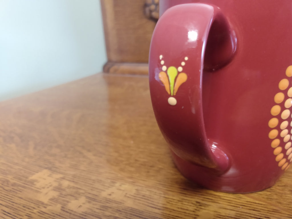 Red mug with yellow and orange dot art mandala