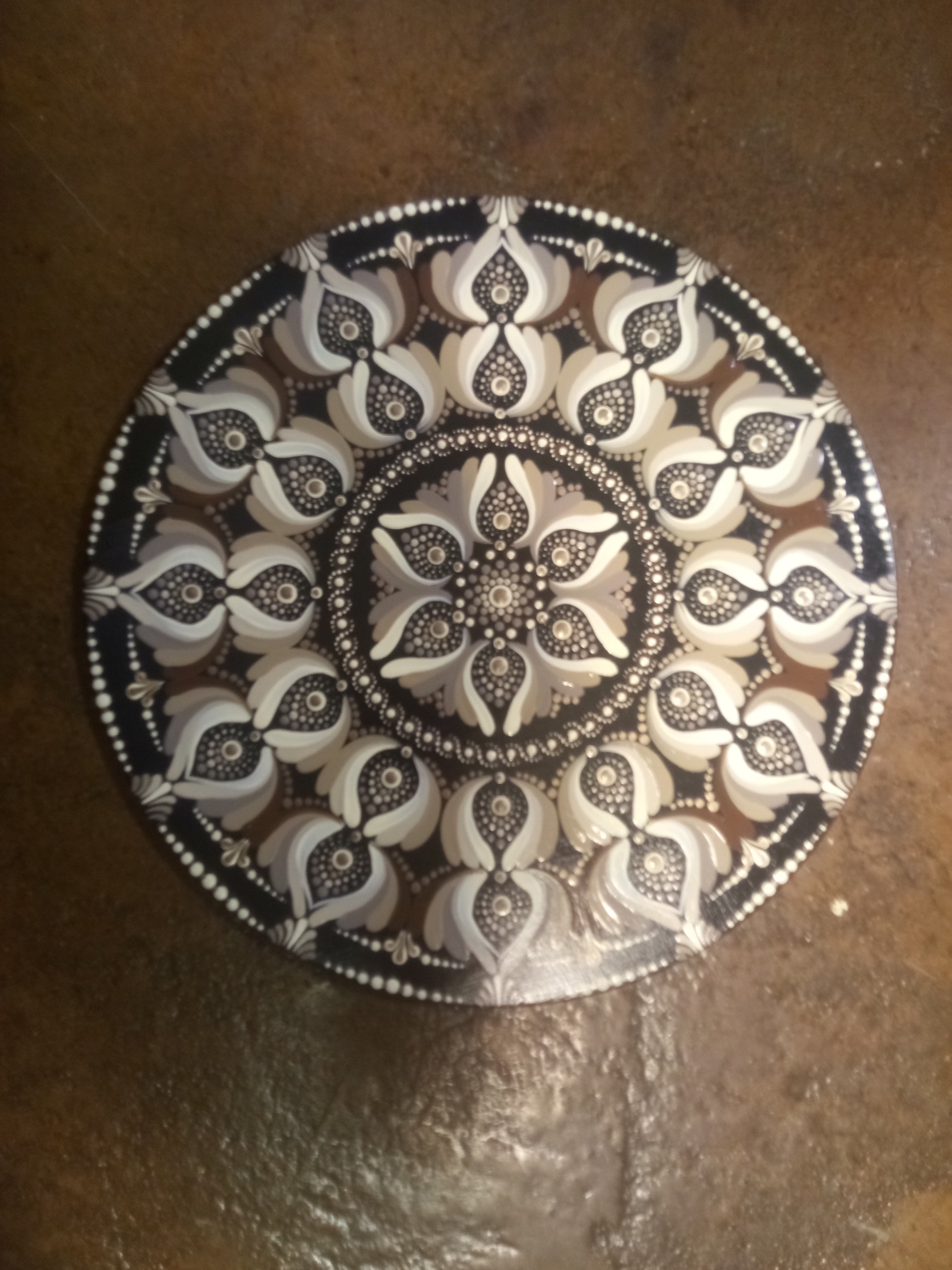Brown and black dot art mandala