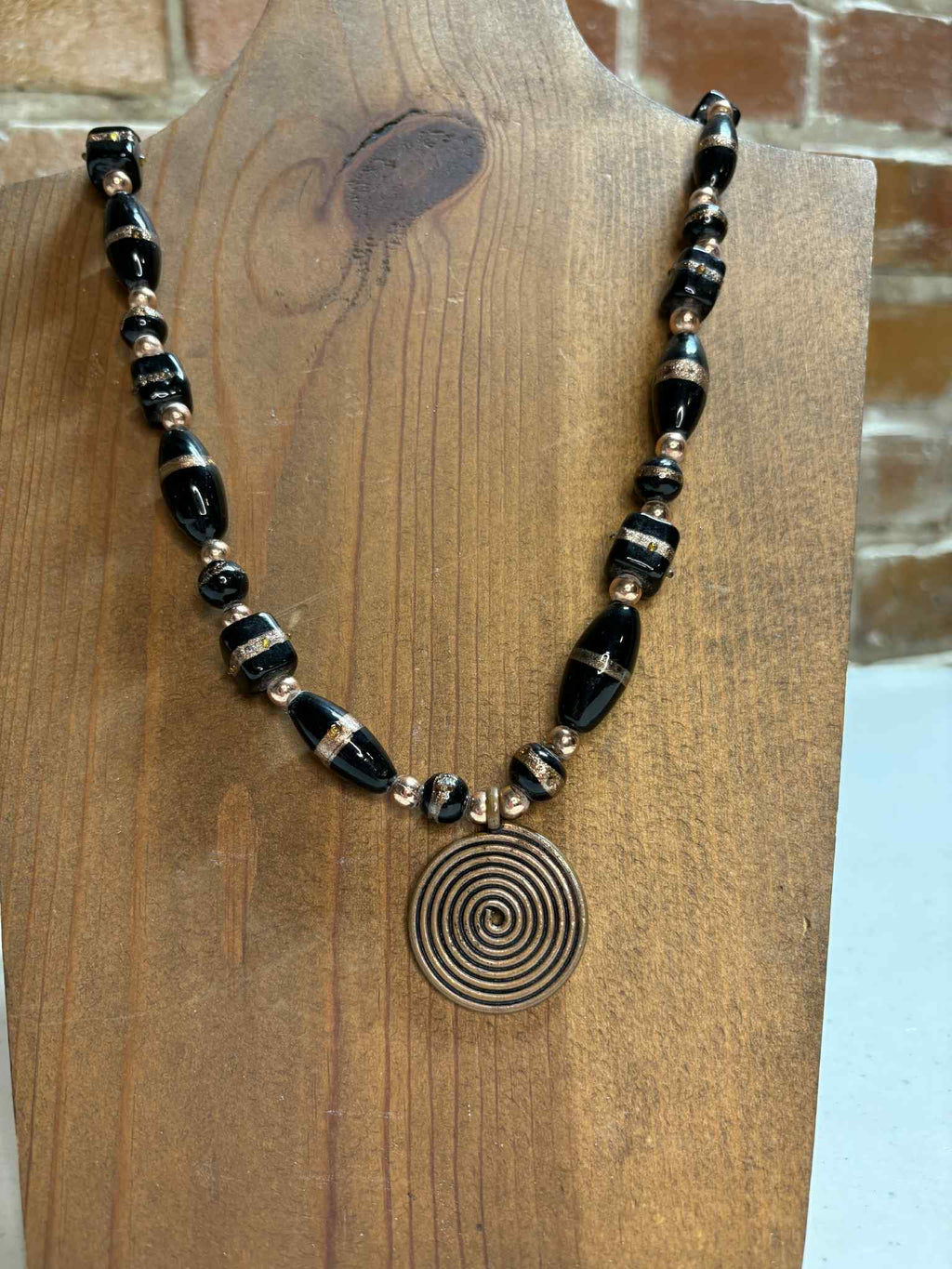 Black and copper with pendant