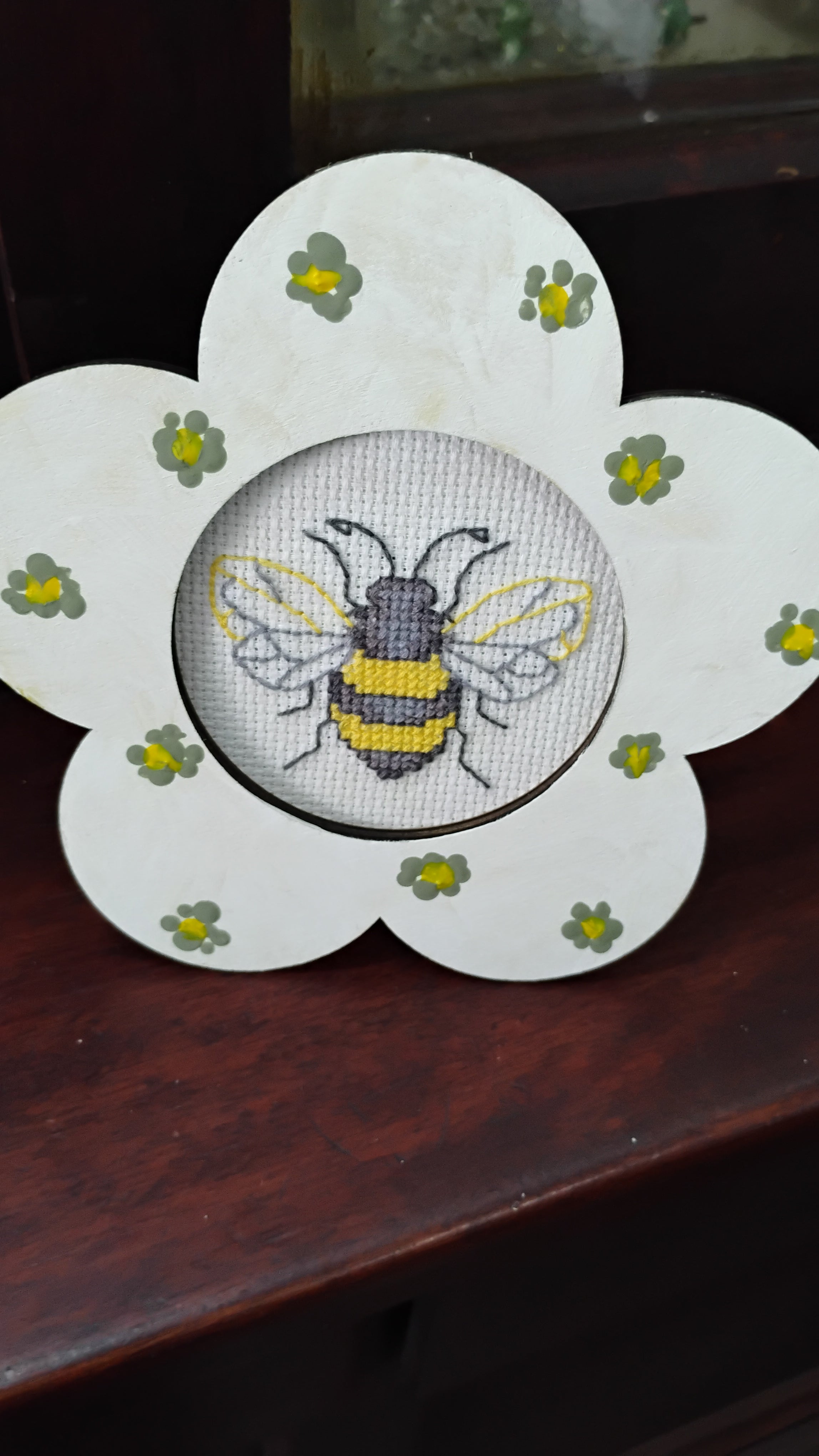 Flower framed bee cross stitch