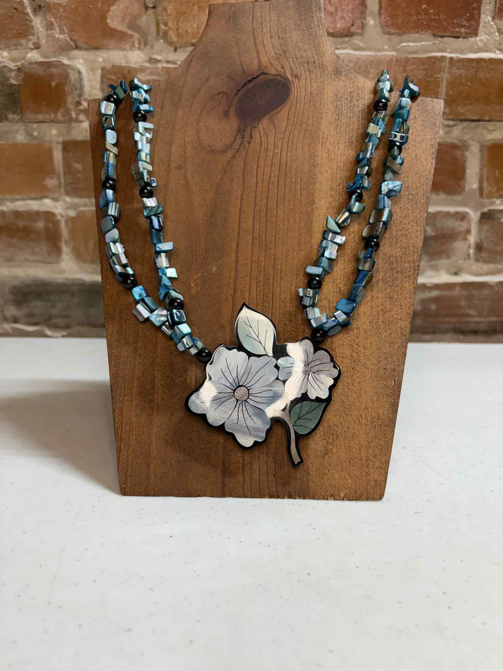 Blue with flower pendant